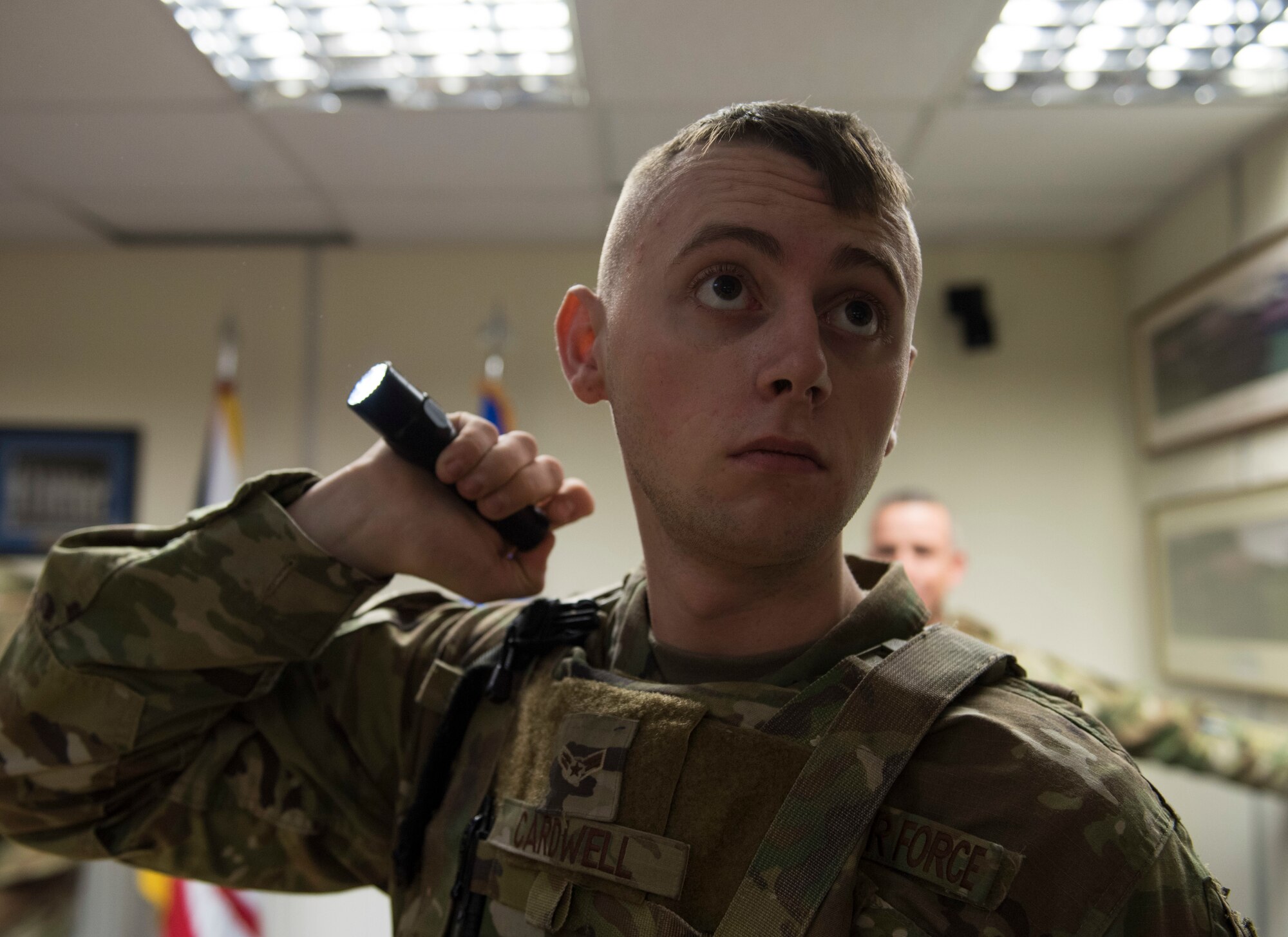 U.S. Air Force Airman 1st Class Christian Cardwell, 422nd Security Forces Squadron response force member, shines a flashlight during a recall exercise at RAF Croughton, England, November 21, 2019. Quarterly recall exercises are a form of readiness for defenders to always be prepared to respond at a moment’s notice. (U.S. Air Force photo by Airman 1st Class Jennifer Zima)