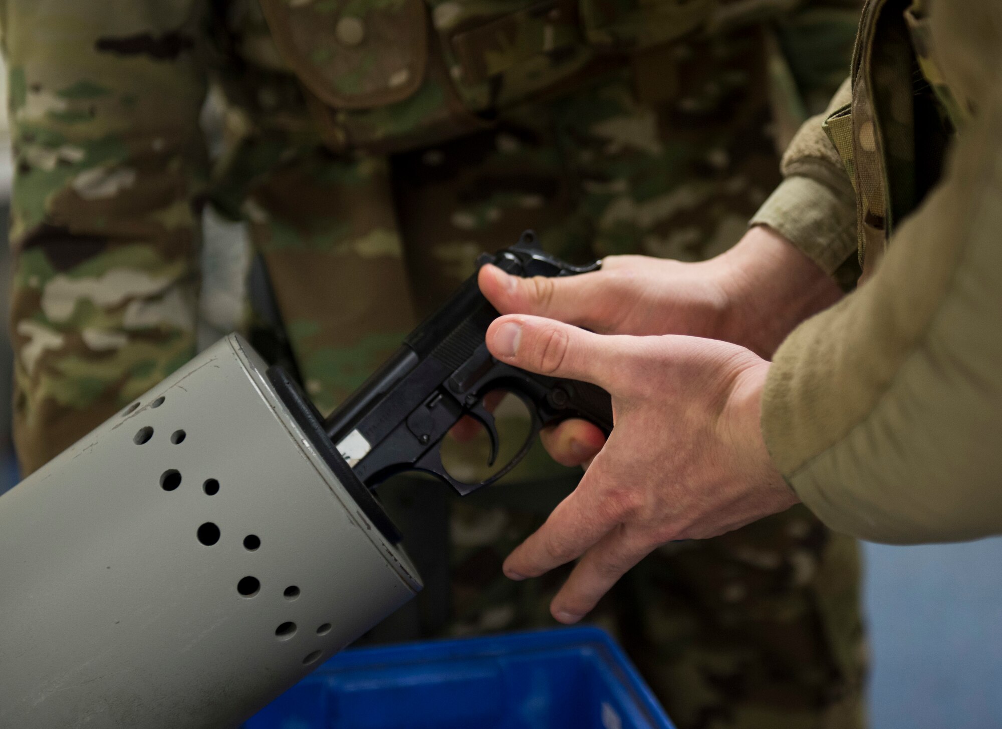 A U.S. Air Force 422nd Security Forces Squadron member clears an M9 pistol during a recall exercise at RAF Croughton, England, November 21, 2019. Quarterly recall exercises are a form of readiness for defenders to always be prepared to respond at a moment’s notice. (U.S. Air Force photo by Airman 1st Class Jennifer Zima)