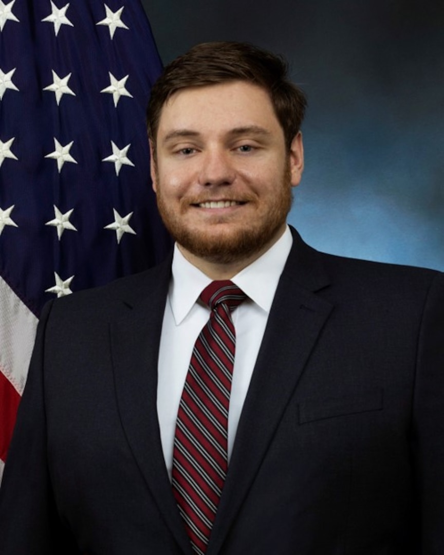 official photo with blue background and American flag