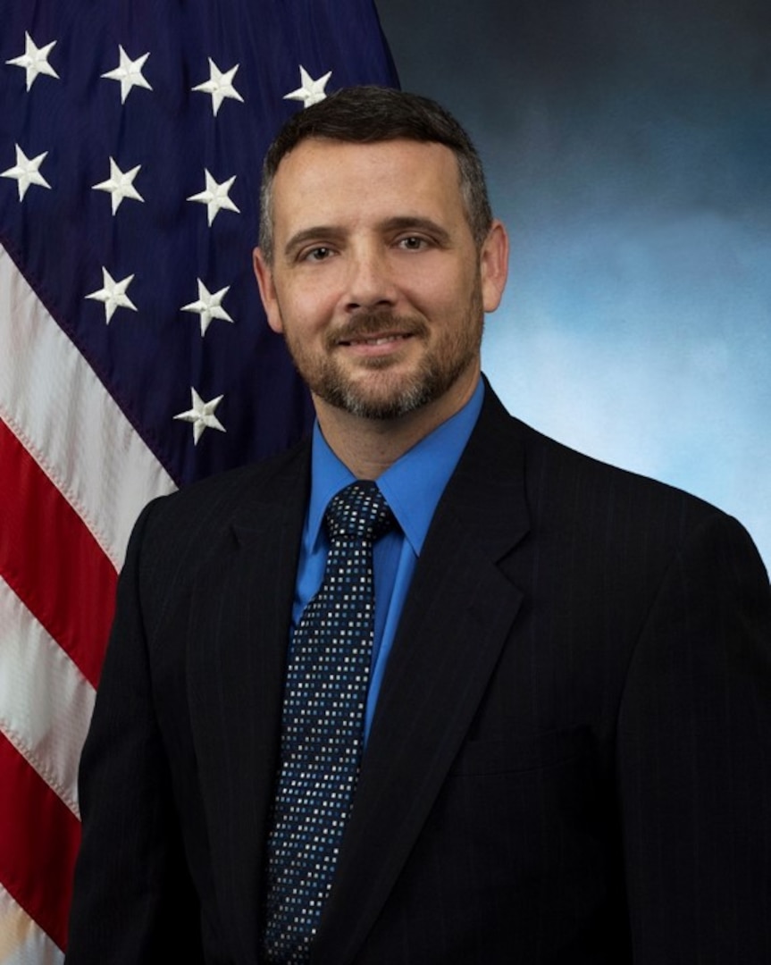 official photo with blue background and American flag
