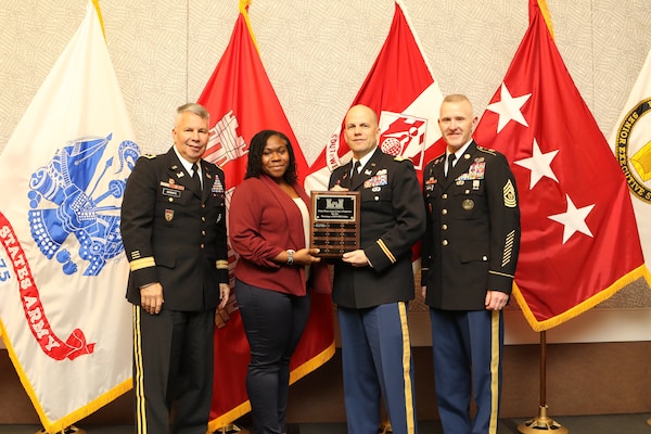 On behalf of the Detroit District,  Lt. Col. Greg Turner (center) and Michelle Williams, LRD small business deputy; receive a Small Business award from Lt. Gen. Todd Semonite, chief of engineers; (left) and Sgt. Major Bradley Houston, command sergeant major (right) during the Small Business Conference in Dallas, Texas.