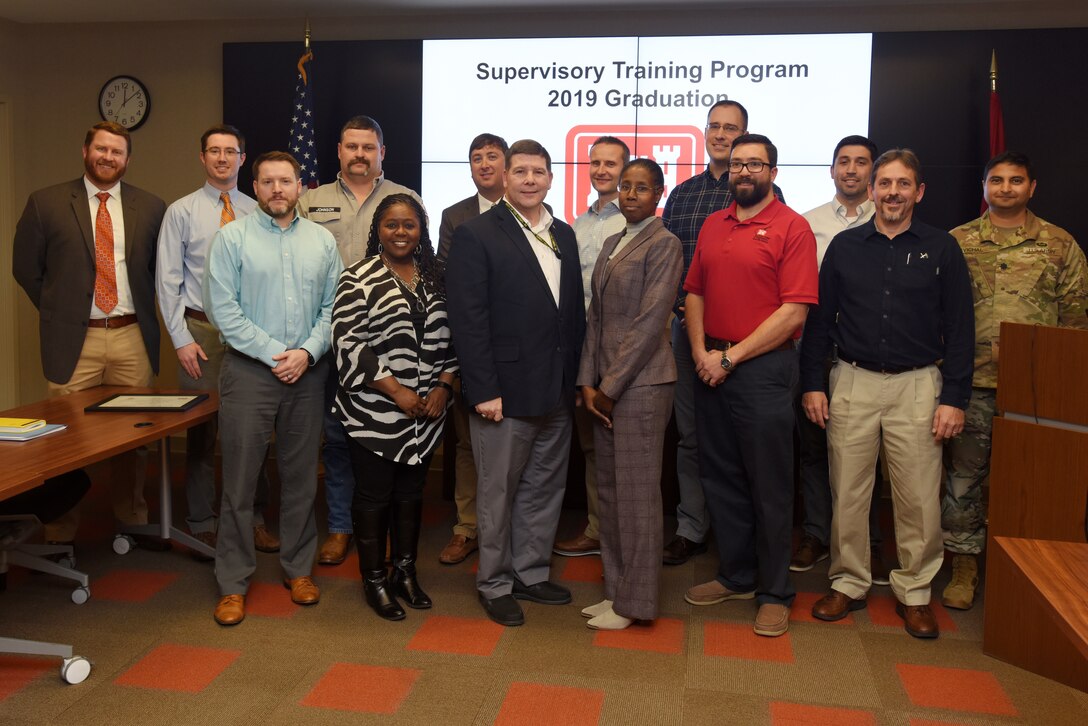 The U.S. Army Corps of Engineers Nashville District's 2019 Supervisory Training Program class graduated during a ceremony Dec. 3, 2019 at the district's headquarters in Nashville, Tenn. STP is a nine-month program where the participants share experiences and learn the core skills required to successfully manage the workforce and develop as a leader. From left to right are Frank Mills, Dylan Grissom, Myles Barton, Ryan Johnson, Stephanie Coleman, Bryan Mangrum, Chris Marshall, Kayl Kite, Cynthia Lightner, William Terry, David Bogema, Ryan Frye, Gerald Lee, and Lt. Col. Sonny B. Avichal, Nashville District commander. Graduates not pictured include Jamie James, Jason Phillips and Isaac Taylor. (USACE photo by Lee Roberts)