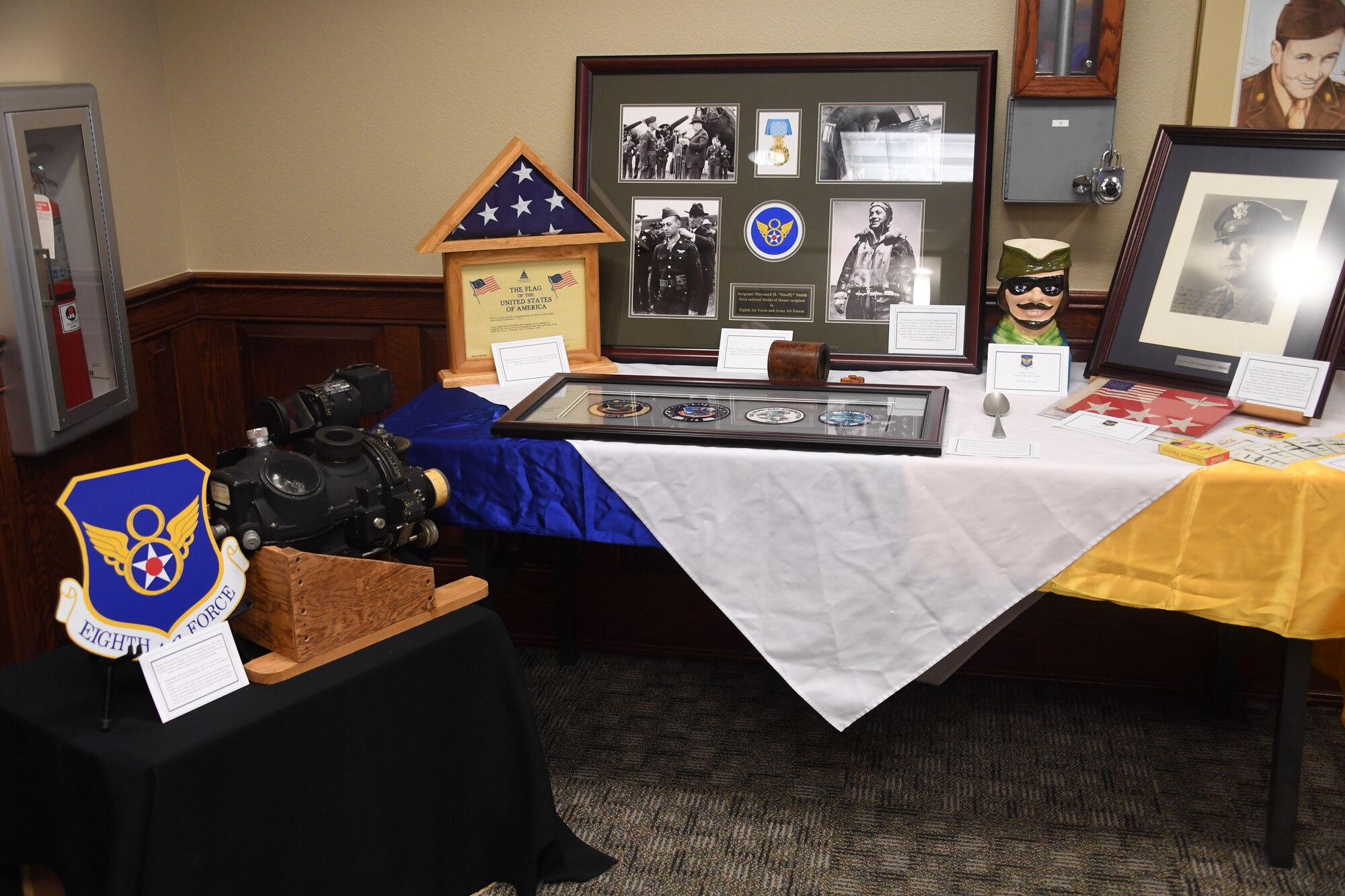 Eighth Air Force artifacts are displayed during the first 8th Air Force, J-GSOC Spouses' Orientation, Nov. 18, 2019. The Toby Mug, historic patches and memorabilia are preserved by the 8th Air Force historian. More than 30 military spouses received an immersion briefing, toured the different J-GSOC work centers and visited with local leadership during the event.