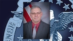 Man with flag and DLA logo in background.