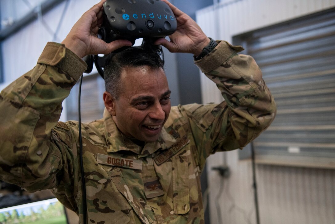 Col. Sanjay A. Gogate, 27th Special Operations Medical Group commander, removes the Enduvo virtual reality system during the Medic Rodeo at Cannon Air Force Base, N.M., Sept. 17, 2019. Over 100 medical Airmen tried out the Enduvo system at the Medic Rodeo, using a variety of scenarios. (U.S. Air Force photo by Senior Airman Vernon R. Walter III)