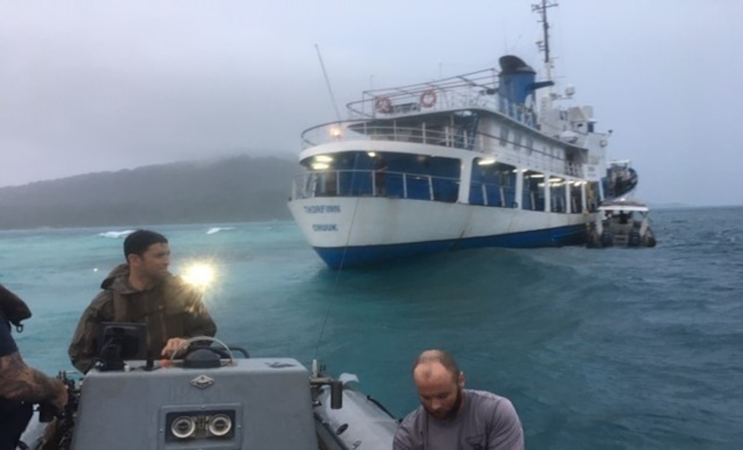CHUUK LAGOON (Dec. 1, 2019) - Civilian mariners from the Military Sealift Command salvage ship USNS Salvor (ARS 52) and divers from Mobile Diving and Salvage Unit 1 provide assistance to a vessel that had run aground in a storm.