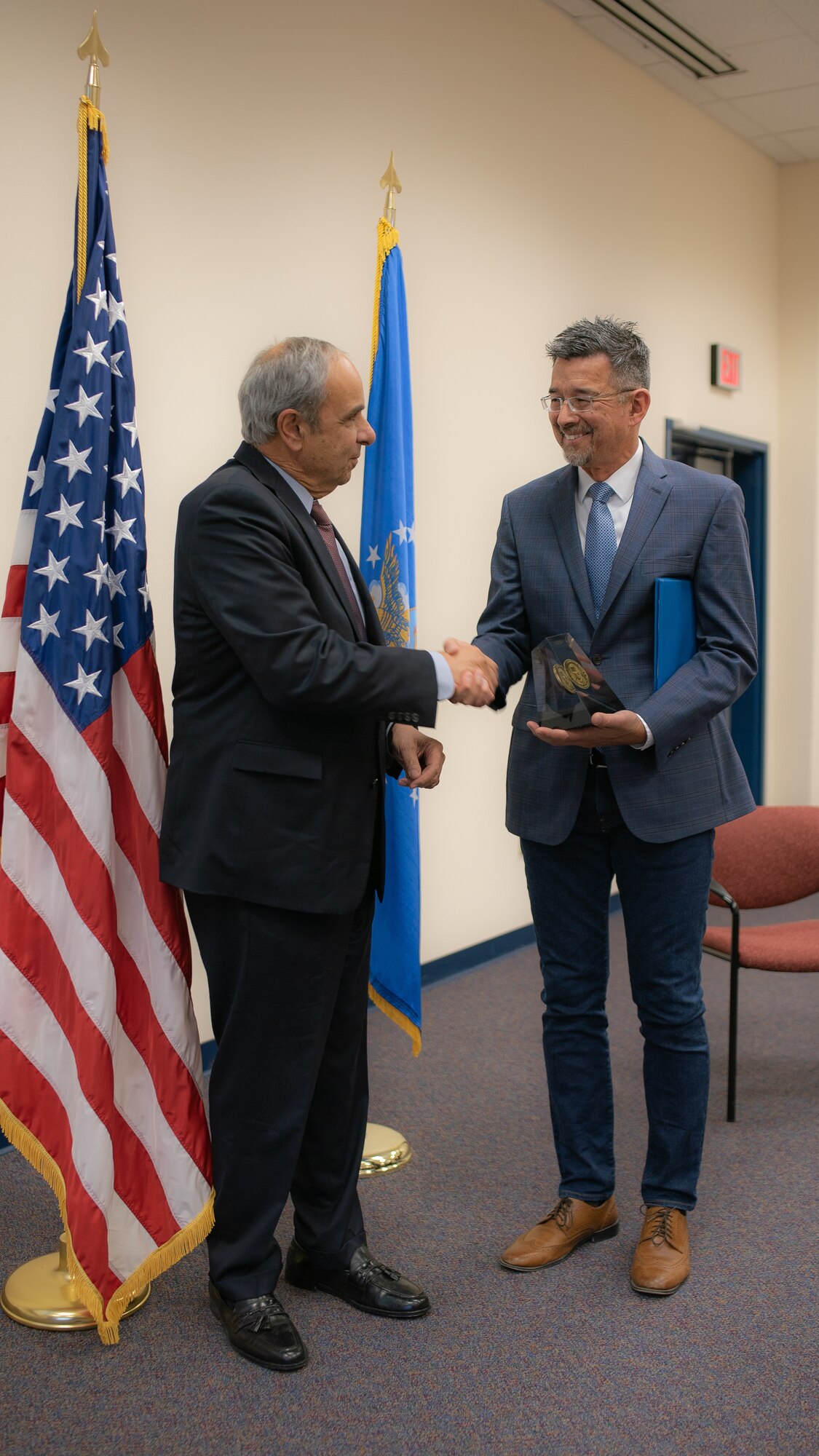 Dr. Richard Joseph Chief Scientist of the Air Force presents Air Force Research Laboratory scientist Dr. Robert Johnson the 2018 Harold Brown Award in a ceremony at AFRL's Starfire Optical Range on Nov. 21, 2019. (U.S. Air Force photo/ Macee Hunt)