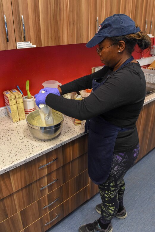 U.S. Air Force Tech. Sgt. Shayla Irtegun, 22nd Expeditionary Air Refueling Squadron materiel management supervisor and USO volunteer, prepares waffle batter for the USO’s weekly Waffle Wednesday, Nov. 13, 2019, at Incirlik Air Base, Turkey. Irtegun is a frequent volunteer and patron at the Incirlik USO and takes every opportunity to give back. (U.S. Air Force photo by Staff Sgt. Eric Mann)