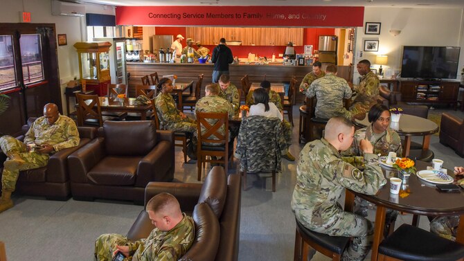 U.S. and other service members relax in the USO, Nov. 13, 2019, at Incirlik Air Base, Turkey. The USO offers free food, events and amenities to help service members stay connected to friends and family back home. (U.S. Air Force photo by Staff Sgt. Eric Mann)