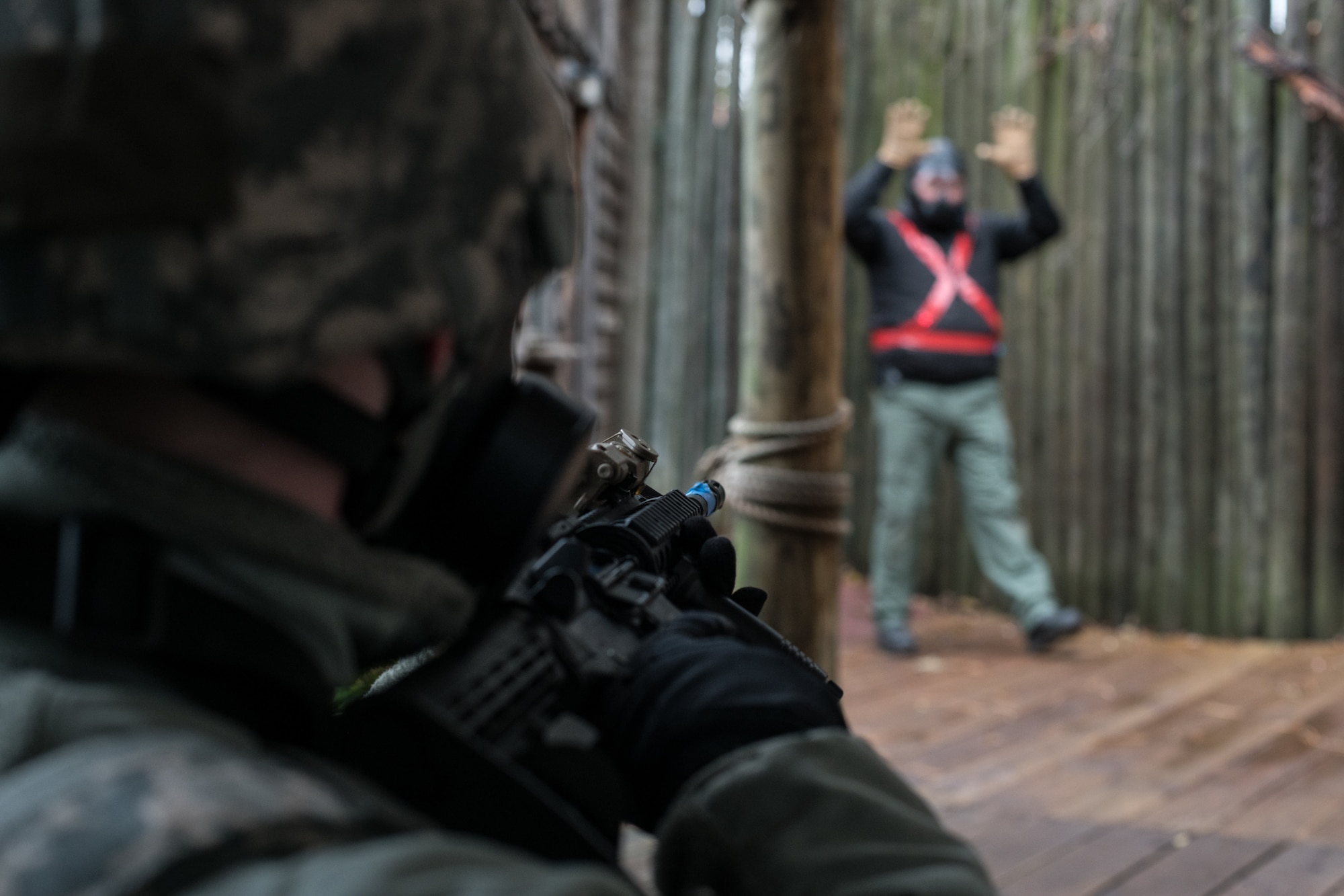 Airman 1st Class Harley Jones, a security forces Airman with the 137th Special Operations Security Forces Squadron from Oklahoma City, holds his weapon on a simulated hostage-taker as he issues verbal commands for surrender during SWAT training conducted by the Oklahoma County Sheriff's Office in Oklahoma City on Nov. 5, 2019. (U.S. Air National Guard photo by Staff Sgt. Brigette Waltermire)