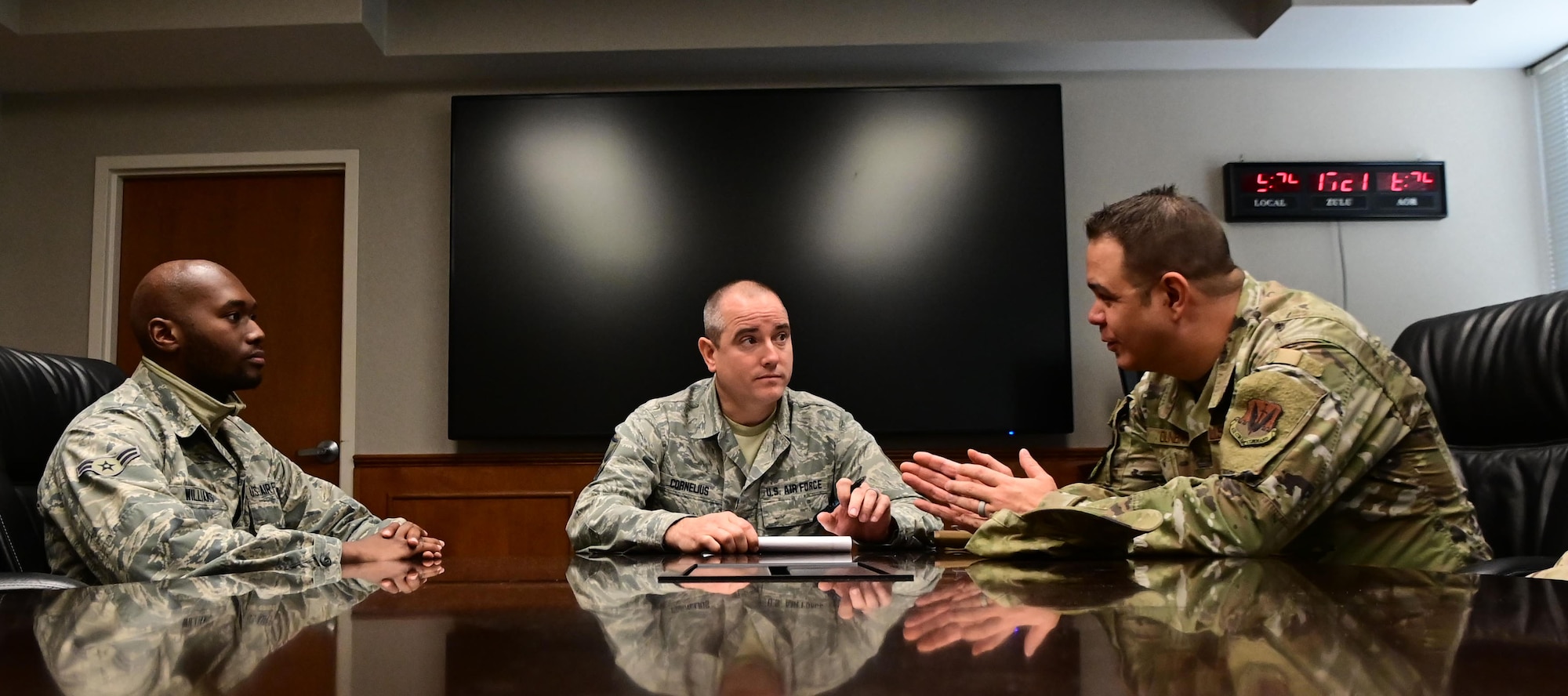 U.S. Air Force Master Sgt. Jeremy Cornelius, center, 118th Wing public affairs superintendent, Tennessee Air National Guard, facilitates a small group discussion with Maj. Robert Dunbar, right, and Airman 1st Class Willie Williams, left, for the 118th WG's resiliency tactical pause Dec. 4, 2019 at Berry Field Air National Guard Base, Nashville, Tennessee. The discussion was part of the Air Force-wide initiative ordered by Air Force Chief of Staff Gen. David Goldfein to combat the rising numbers of suicides in the Air Force.