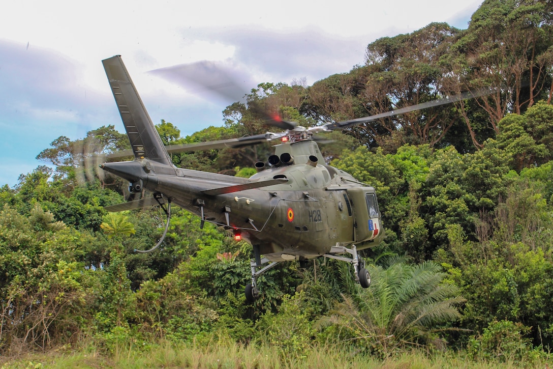 A Belgian Army AW109 Eurocopter with the 1st Wing Mobile Air Operation Team, prepares to land during a jungle survival training event in Akanda, Gabon, Nov. 20, 2019. U.S. Marines with Special Purpose Marine Air-Ground Task Force-Crisis Response-Africa 20.1, Marine Forces Europe and Africa, are working and training with partner-nation militaries giving U.S. forces the opportunity to refine processes and procedures, increase proficiency, and enhance the ability to respond to contingencies across the region. SPMAGTF-CR-AF is deployed to conduct crisis-response and theater-security operations in Africa and promote regional stability by conducting military-to-military training exercises throughout Europe and Africa. (U.S. Marine Corps photo by 2nd Lt. Andrew Soto)