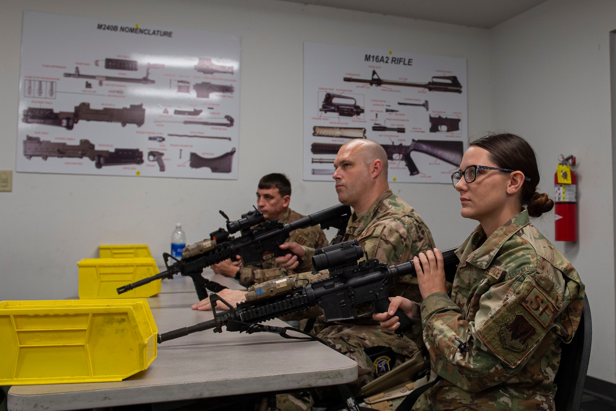 Photo of Airmen learning clearing procedures during an M4 and M9 Air Force Qualification Course