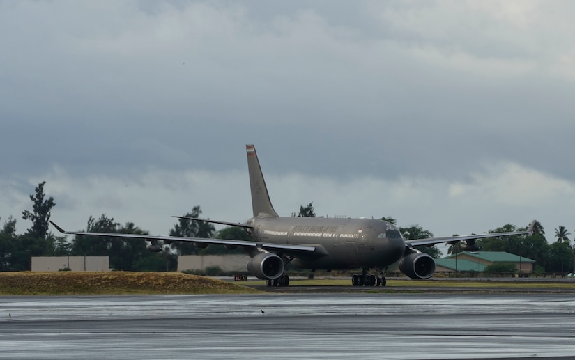 An airplane lands on a runway.