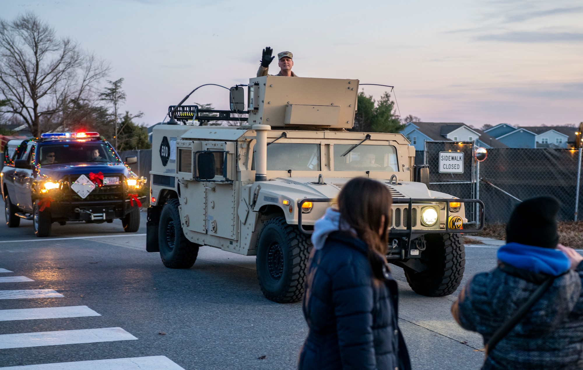 Col. Joel Safranek, 436th Airlift Wing commander, waves during the 2019 Dover Air Force Base Holiday Parade Dec. 3, 2019, at Dover Air Force Base, Del. A variety of military and first responder vehicles were decorated for the event. (U.S. Air Force photo by Senior Airman Christopher Quail)