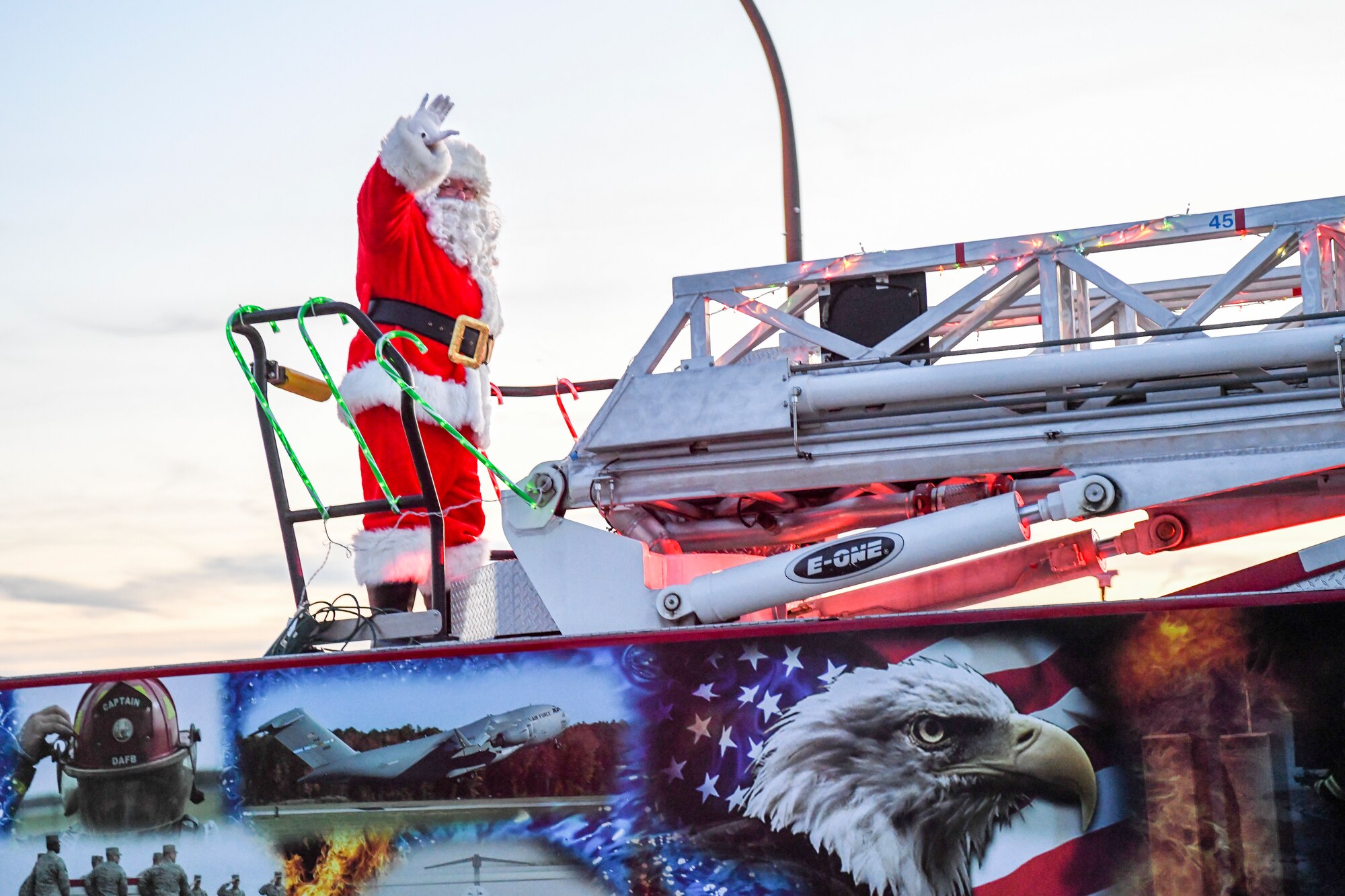 Santa waves from a 436th Civil Engineer Squadron fire truck to all the family and friends attending the 2019 Dover Air Force Base Holiday Parade Dec. 3, 2019, at Dover Air Force Base, Del. A variety of military and first responder vehicles were decorated for the event. (U.S. Air Force photo by Senior Airman Christopher Quail)