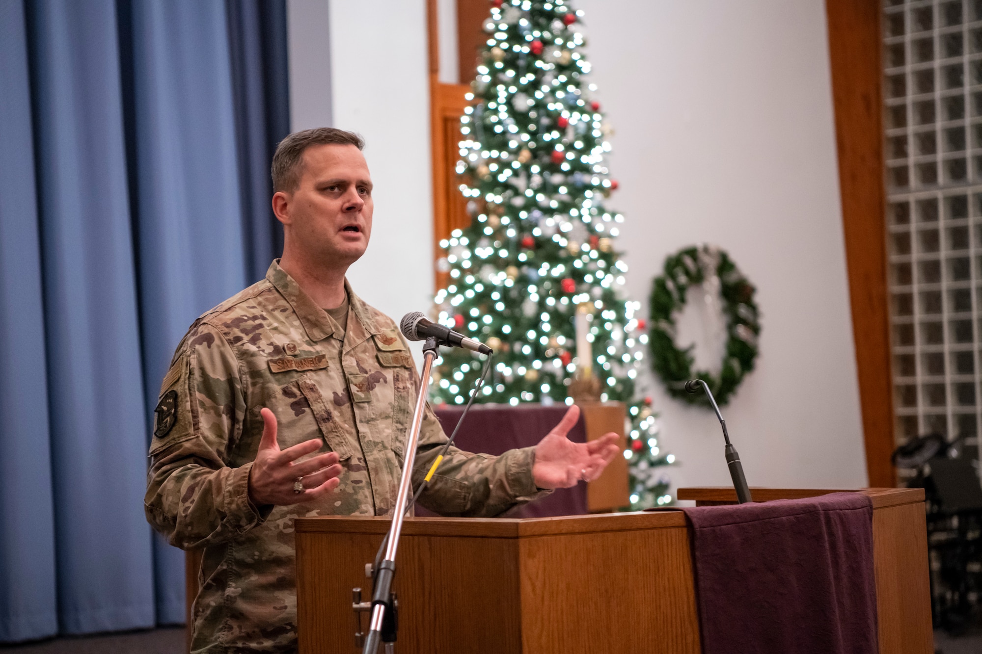 Col. Joel Safranek, 436th Airlift Wing commander, speaks at the annual Christmas tree lighting ceremony Dec. 3, 2019, Dover Air Force Base, Del. The event included Christmas carols, tree lighting and a visit from Santa Claus. (U.S. Air Force photo by Senior Airman Christopher Quail)