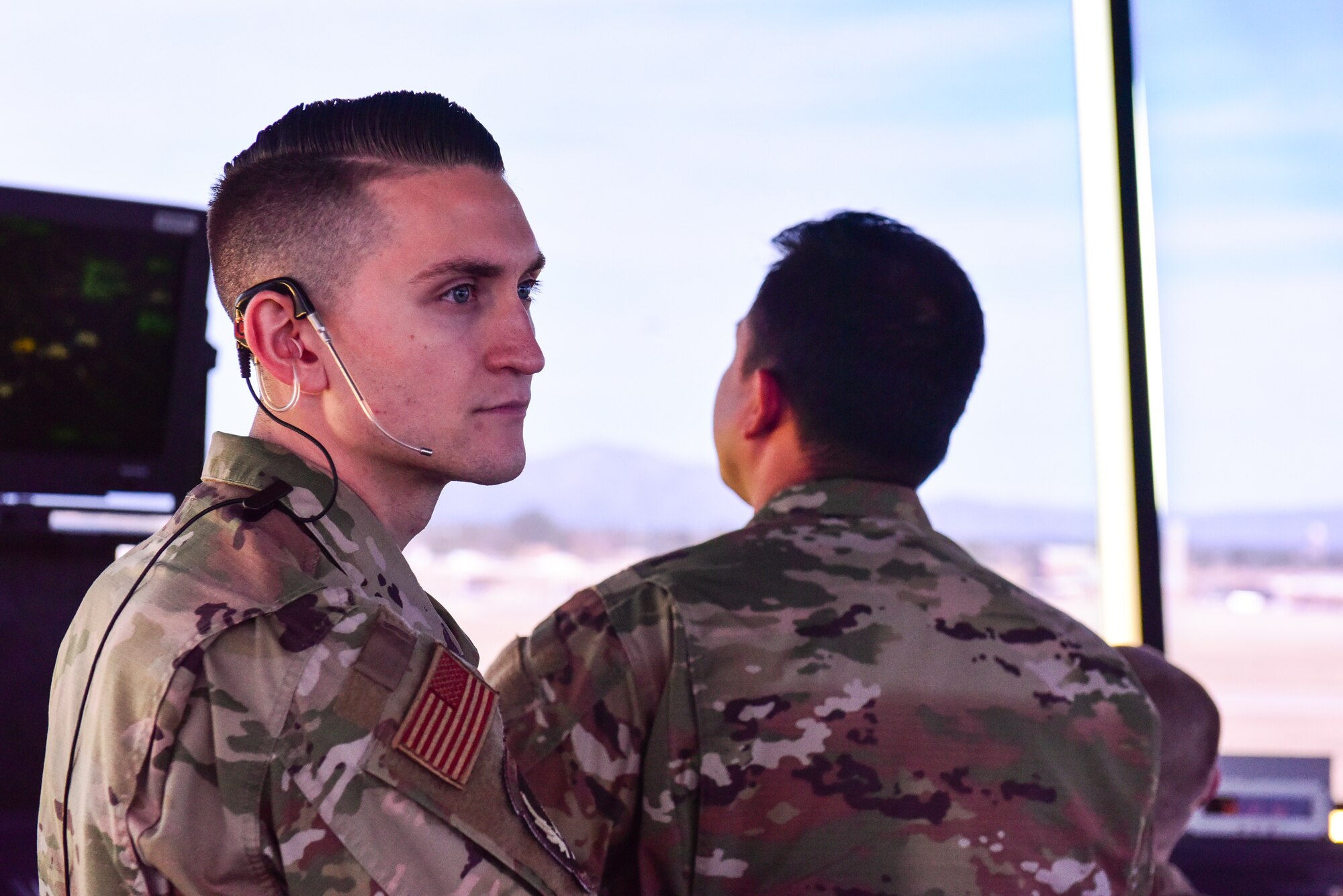 A photo of an Airman in the Air Traffic Control Tower