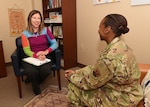355th Medical Group Mental Health clinic personnel discuss routine tasks at Davis-Monthan Air Force Base, Ariz., Nov. 27, 2019.