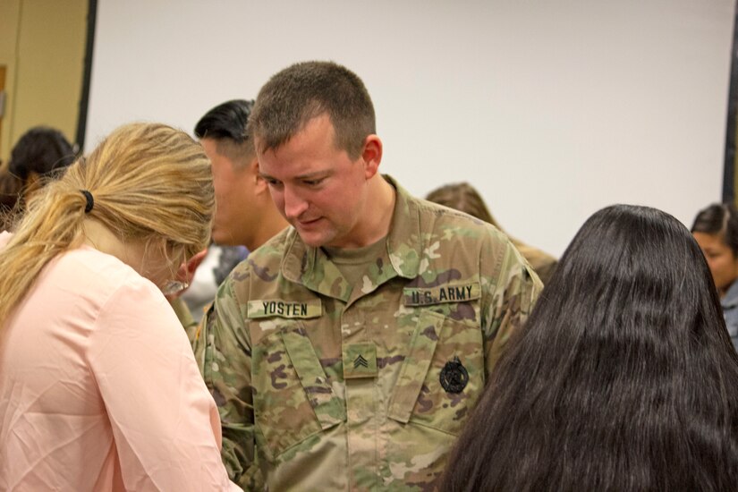 Army Sgt. Andrew Yosten, a combat medic and medical recruiter for the U.S. Army Medical Recruiting Station, Houston, works with premedical students during a Stop-the-Bleed Clinic during the American Medical Student Association Premed Fest at Texas A&M University Nov. 24.