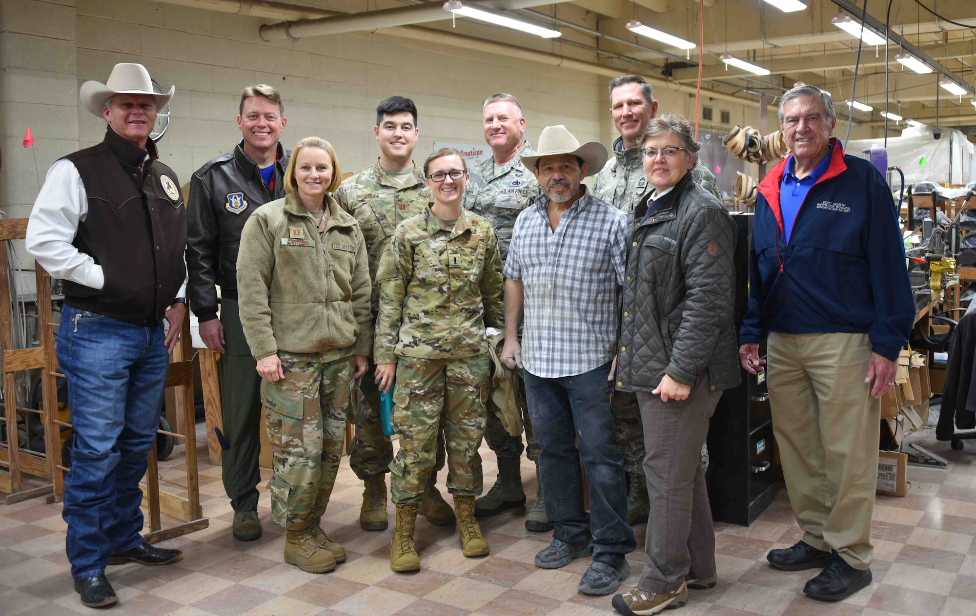 301st Fighter Wing Aircraft Maintenance Squadron Honorary Commander Mr. Keith Mundee (left), who is also the president of American Hat Co., poses alongside 301 FW Commander Col. Mitch Hanson and several other members of the wing's leadership before a factory tour of American Hat Company in Bowie, Texas on November 15, 2019. The 301st Fighter Wing Honorary Commanders Program has invited civic leaders to many behind-the-scenes military tours but this was the first time we were hosted by one of our honorary commanders. (U.S. Air Force photo by Capt. Jessica Gross)