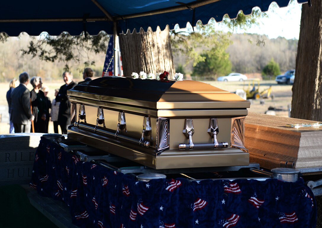 Flowers lay atop a casket during a funeral and burial service with full military honors Dec. 4, 2019, at Duck Hill Cemetery in Winona, Miss. Former Army Air Corps Capt. Charles T. Hull, a decorated World War II bomber pilot, earned the Distinguished Flying Cross and the Air Service Medal for his outstanding service upon returning from his tour in Europe. (U.S. Air Force photo by Airman Hannah 1st Class Bean)
