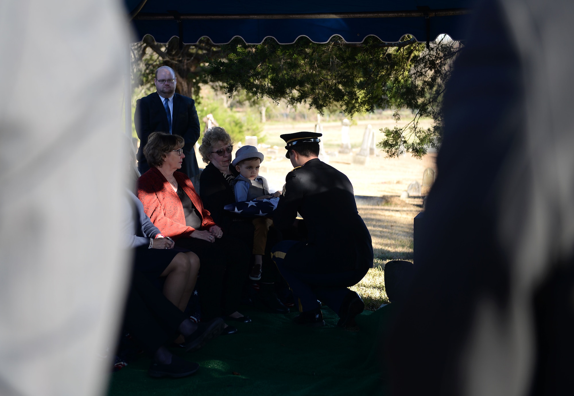 An Army honor guardsman gives Sandra Inman, niece of former Army Air Corps Capt. Charles T. Hull -- a decorated World War II bomber pilot – a folded American flag during a funeral and burial service with full military honors Dec. 4, 2019, at Duck Hill Cemetery in Winona, Miss. Hull began his service in the Army Air Corps in November 1942, where he attended the Columbus Army Flying School on what is now Columbus Air Force Base. (U.S. Air Force photo by Airman Hannah 1st Class Bean)