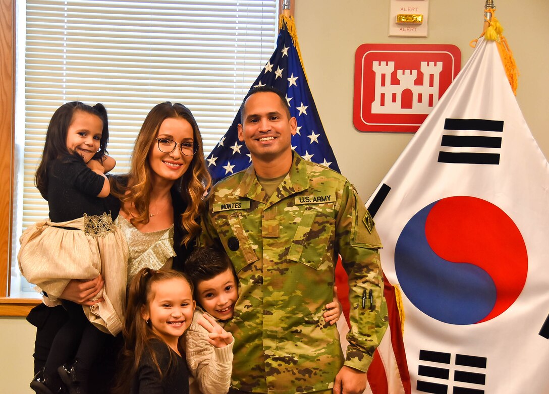 David Montes, a U.S. Army Corps of Engineers (USACE), Far East District (FED) project manager, with his family after he took the Oath of Office and was sworn in as a U.S. Army Second Lieutenant and Chaplain candidate, at the district headquarters, Camp Humphreys, South Korea. Montes’ family and other members of the FED were present at his ceremony