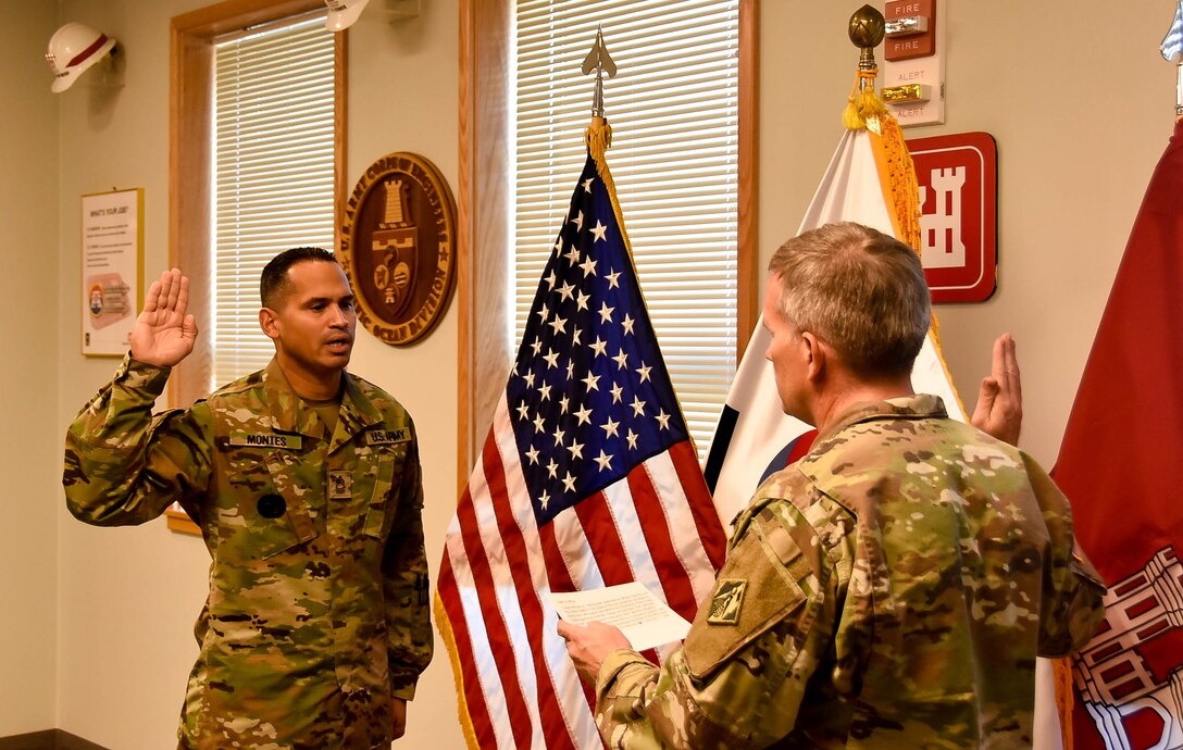 David Montes, a U.S. Army Corps of Engineers (USACE), Far East District (FED) project manager, with his family after he took the Oath of Office and was sworn in as a U.S. Army Second Lieutenant and Chaplain candidate, at the district headquarters, Camp Humphreys, South Korea. Montes’ family and other members of the FED were present at his ceremony