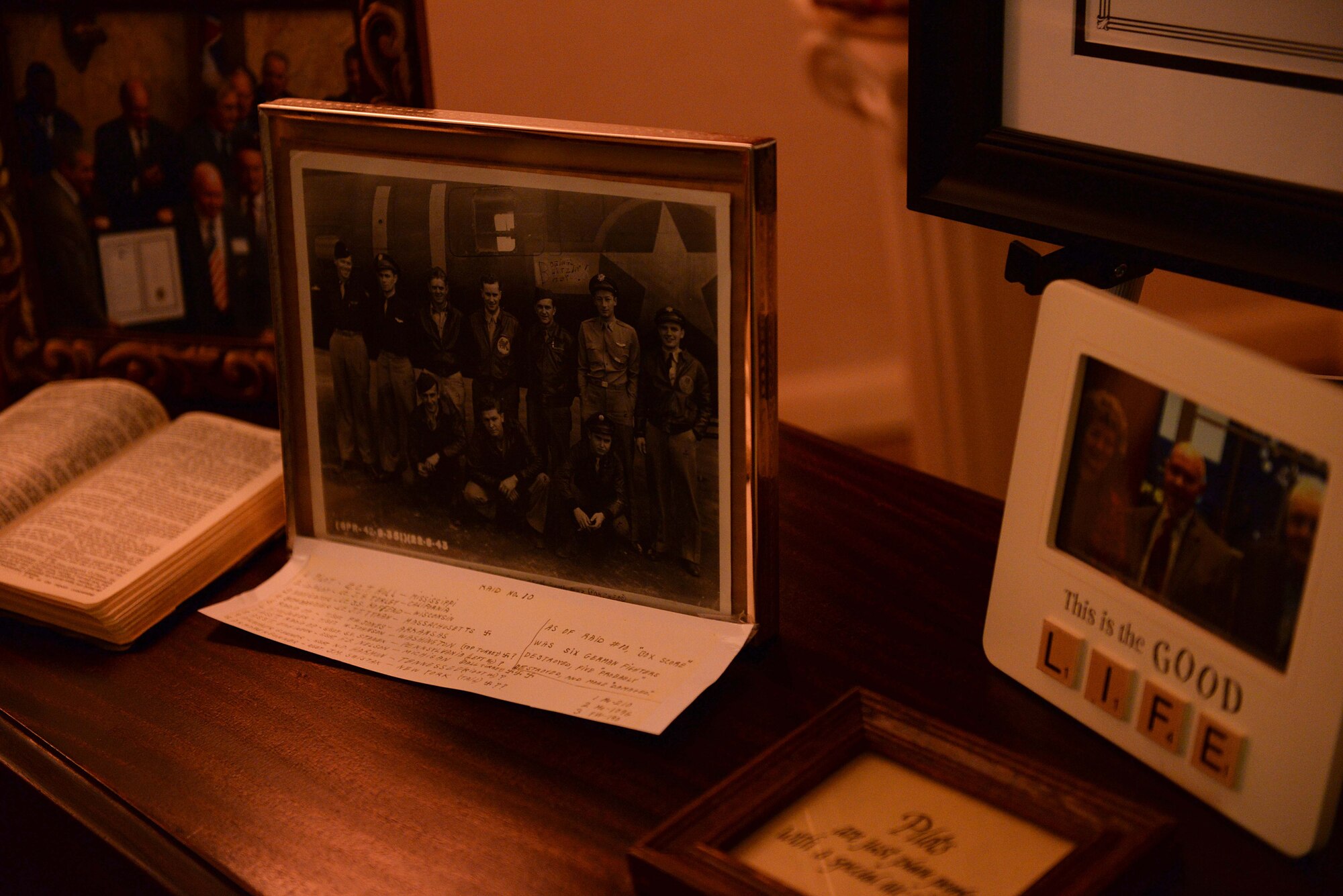 Various memorabilia of former Army Air Corps Capt. Charles T. Hull sits on a table during a funeral and burial service Dec. 4, 2019, with full military honors at the Oliver Funeral Home in Winona, Miss. Families, friends and loved ones gathered together to remember Hull, a decorated World War II bomber pilot who survived 25 missions in the European Theater. (U.S. Air Force photo by Airman 1st Class Hannah Bean)