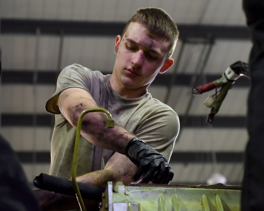 Airman 1st Class Isaiah Schwarber, 48th Logistics Readiness Squadron vehicle maintenance journeyman, performs maintenance on a fire truck at Royal Air Force Lakenheath, England, Nov. 22, 2019. The mission of the Vehicle Management flight is to ensure the readiness, reliability and longevity of the Liberty Wing vehicle fleet. (U.S. Air Force photo by Airman 1st Class Jessi Monte)