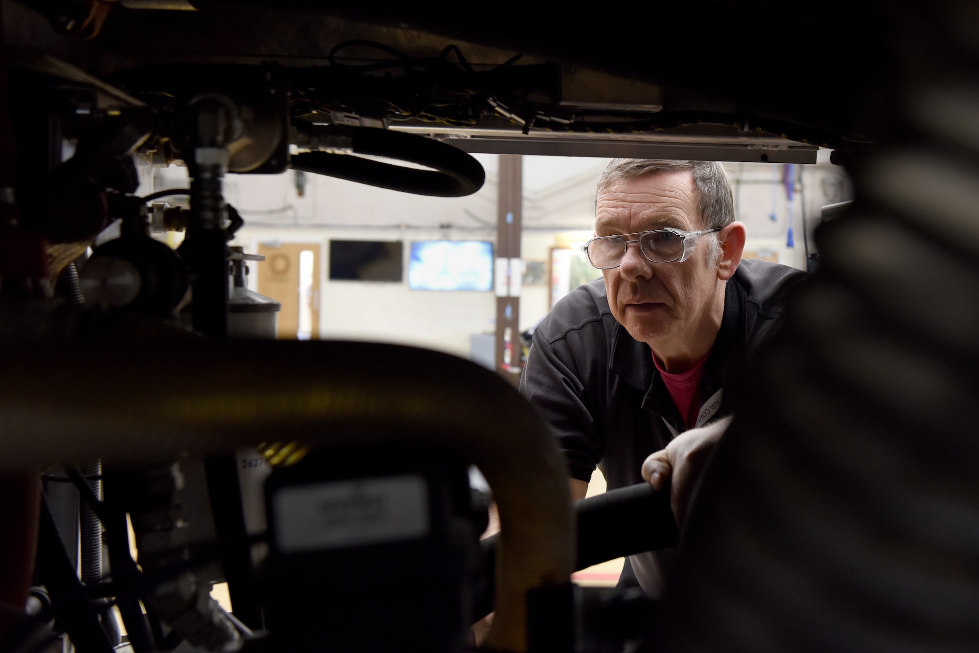 Robert Hook, 48th Logistics Readiness Squadron fire truck maintenance supervisor, inspects internal fire truck components at Royal Air Force Lakenheath, England, Nov. 22, 2019. The mission for fire truck maintenance is to provide quality service for the fire department vehicle fleet enabling protection for flying missions and structural facilities. (U.S. Air Force photo by Airman 1st Class Jessi Monte)