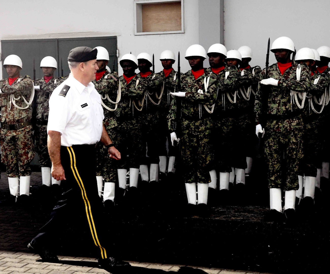 U.S. Army Maj. Gen. Jeff Marlette, South Dakota National Guard adjutant general, conducts a pass and review of Suriname Defense Force service members in Paramaribo, Suriname, Nov. 22, 2019. SDNG and SDF officials conducted a senior leader engagement as part of the State Partnership Program, which seeks to support security cooperation relationships by sharing experiences and best practices.