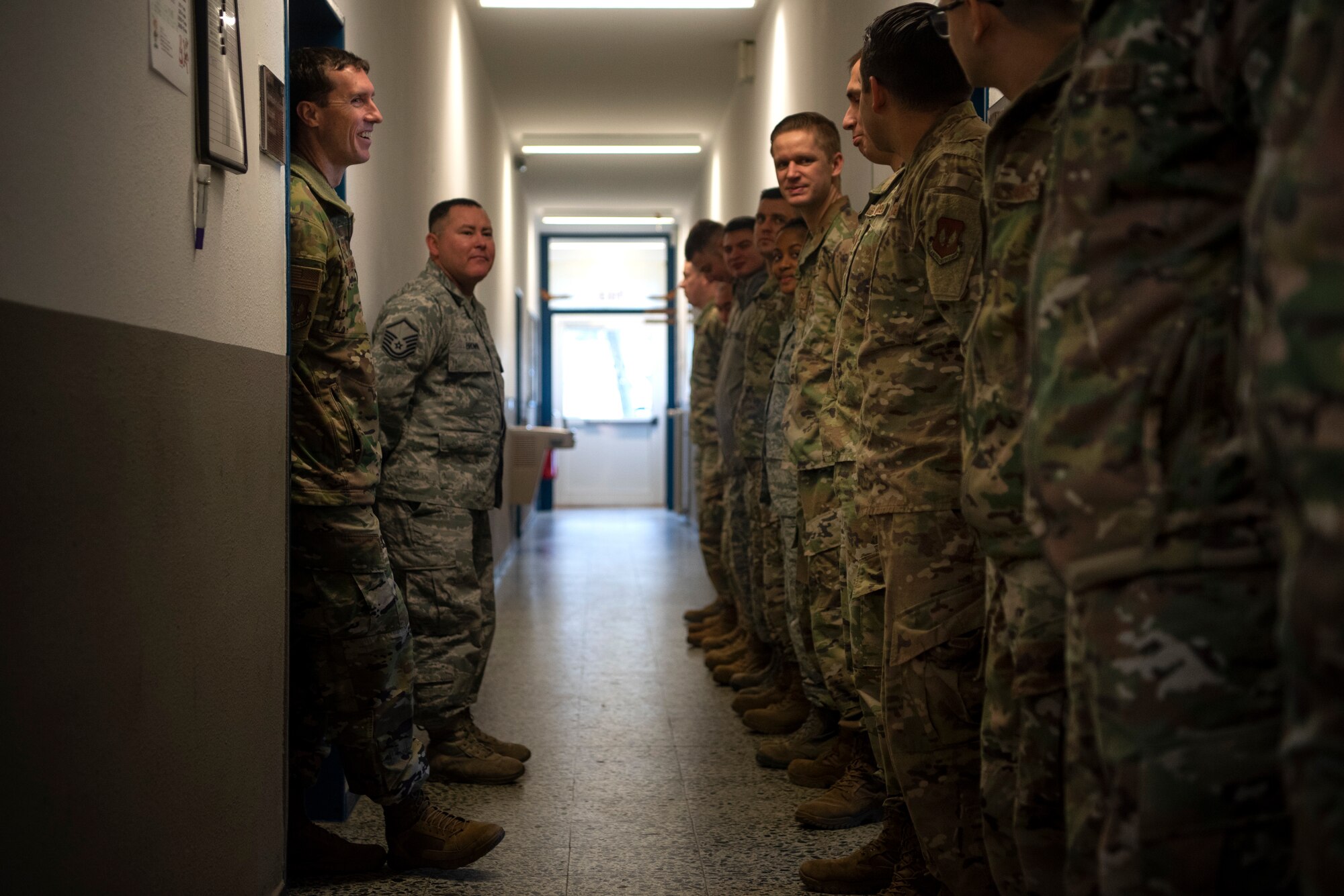 U.S. Air Force Col. David Epperson, 52nd Fighter Wing commander, left, speaks with Airmen from the 702nd Munitions Support Squadron at Buechel Air Base, Germany, Dec. 5, 2019, during a commander immersion tour. Epperson asked Airmen about the strengths and challenges that come with being stationed at a geographically separated unit. (U.S. Air Force photo by Airman 1st Class Valerie Seelye)