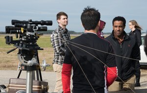 Team members of the NASA Langley Research Center prepare to test a laser at Joint Base Langley-Eustis, Virginia, Nov. 26, 2019. The NASA LaRC hopes this new technology will improve the safety of astronauts during their mission. (U.S. Air Force photo by Airman 1st Class Sarah Dowe)