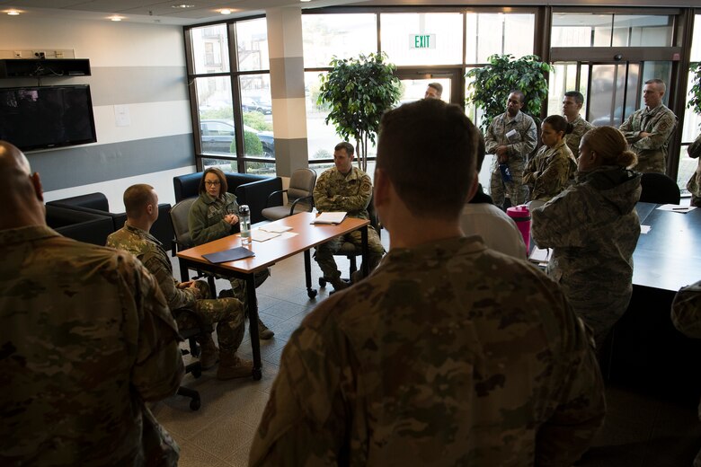 U.S. Air Force Senior Master Sgt. Shiloh Smith, 86th Logistics Readiness Squadron first sergeant, center, practices dispute resolution techniques during the Negotiation and Dispute Resolution Course held at the U.S. Air Forces in Europe and Air Forces Africa Conference Center, Ramstein Air Base, Germany, Dec. 4, 2019.