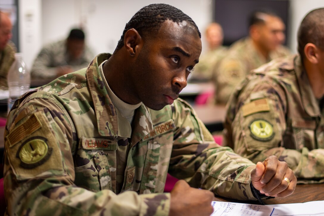 U.S. Air Force Tech. Sgt. Ernie Williams, 435th Construction Training Squadron electrical contingency training NCO in charge, takes notes during a Russian language course at Ramstein Air Base, Germany, Dec. 3, 2019. The curriculum covered the Russian language as well as cultural aspects of the country and its history. (U.S. Air Force photo by Staff Sgt. Devin Boyer)