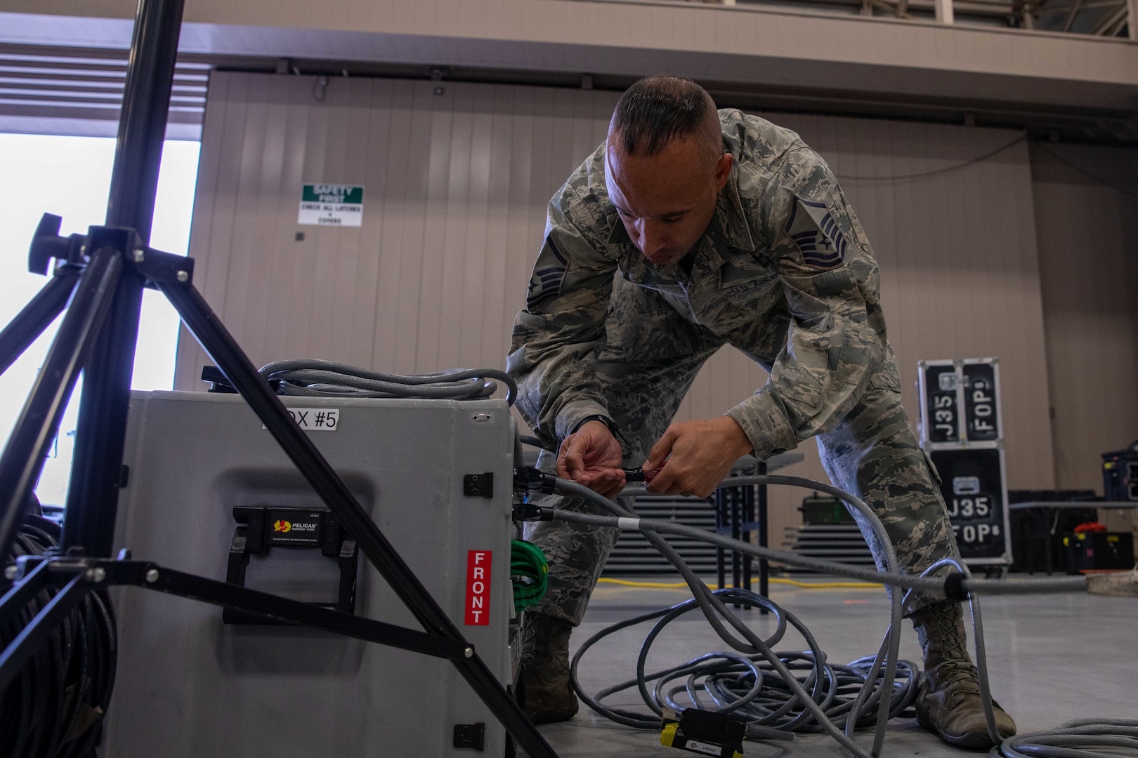 U.S. Air Force Master Sgt. Seneca Linder, a member of Joint Task Force Civil Support’s (JTF-CS) communications directorate, sets up a network distribution box during a main command post exercise at Felker Army Airfield at Joint Base Langley-Eustis. The four-day exercise familiarized the command with established procedures on deploying the main command post, and tested and verified the command’s online collaborative tools and systems. (Official DoD photo by Mass Communication Specialist 3rd Class Michael Redd/RELEASED)