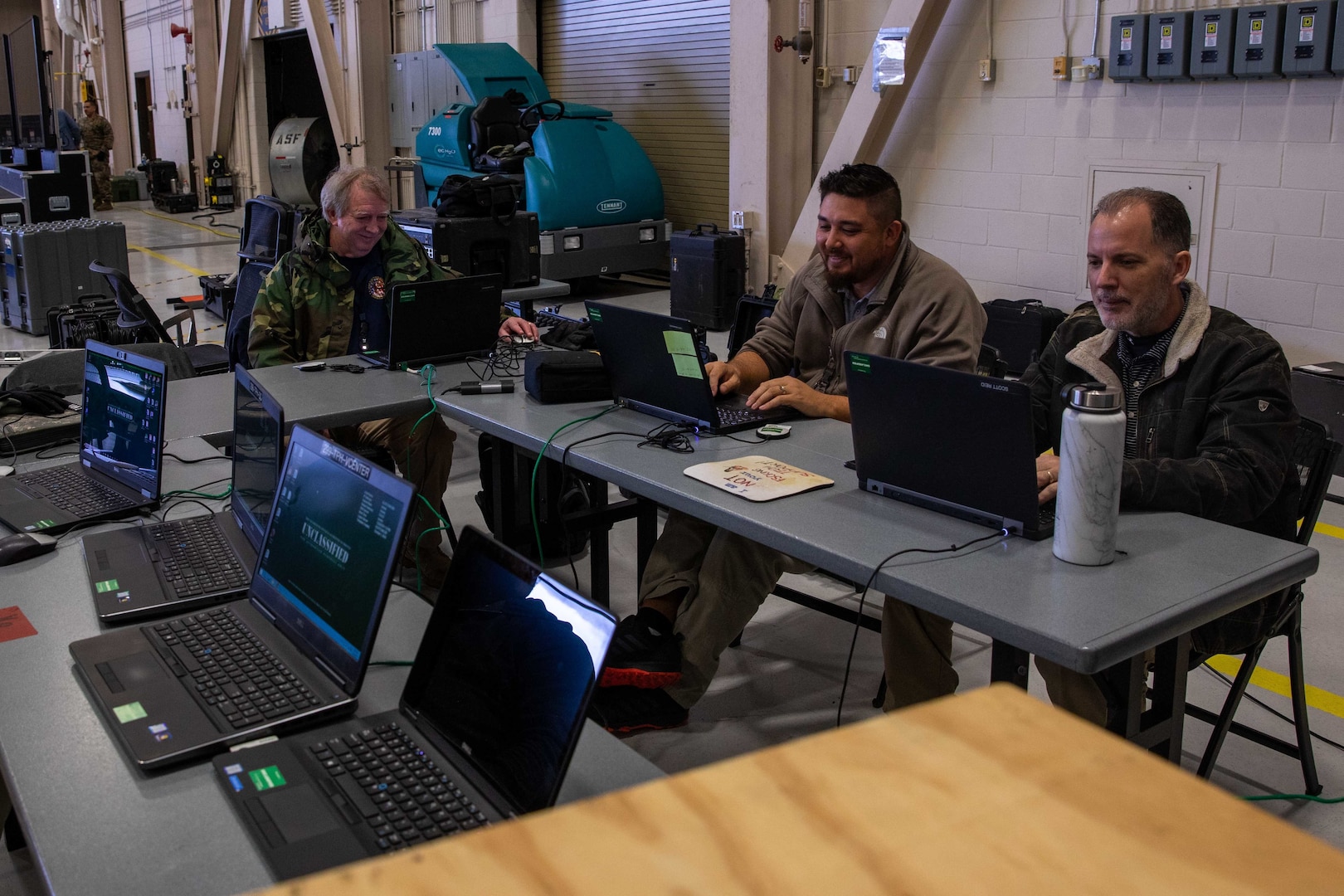 Members of Joint Task Force Civil Support’s (JTF-CS) communications directorate monitor and maintain the command’s deployed network during a main command post exercise at Felker Army Airfield at Joint Base Langley-Eustis. The four-day exercise familiarized the command with established procedures on deploying the main command post, and tested and verified the command’s online collaborative tools and systems. (Official DoD photo by Mass Communication Specialist 3rd Class Michael Redd/RELEASED)