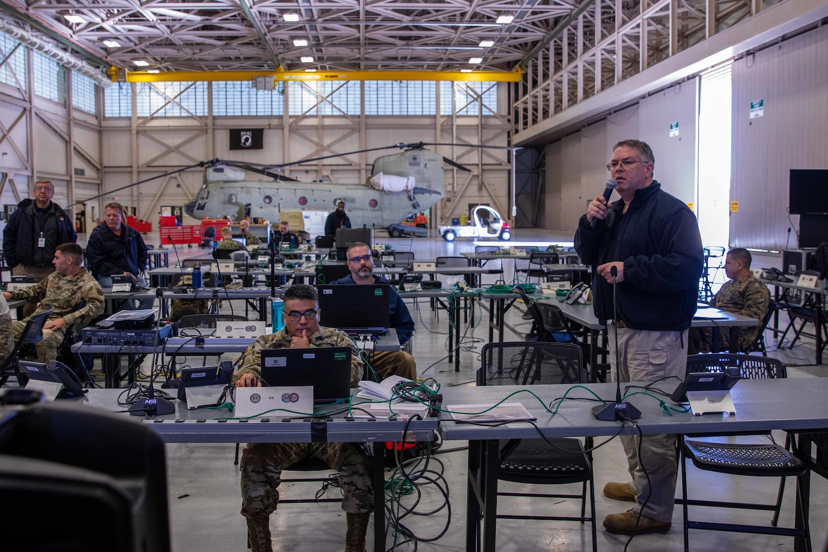 Kenneth Trate, a member of Joint Task Force Civil Support’s (JTF-CS) operations directorate, briefs joint operations center (JOC) personnel on the command’s collaborative tools during a main command post exercise at Felker Army Airfield at Joint Base Langley-Eustis. The four-day exercise familiarized the command with established procedures on deploying the main command post, and tested and verified the command’s online collaborative tools and systems. (Official DoD photo by Mass Communication Specialist 3rd Class Michael Redd/RELEASED)