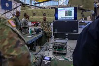 U.S. Army Lt. Col. Edward Brown, a member of Joint Task Force Civil Support’s (JTF-CS) logistics directorate briefs and trains other members of the directorate during a command post setup and communications exercise at Felker Army Airfield at Joint Base Langley-Eustis. The four-day exercise familiarized the command with established procedures on deploying the main command post, and tested and verified the command’s online collaborative tools and systems. (Official DoD photo by Mass Communication Specialist 3rd Class Michael Redd/RELEASED)