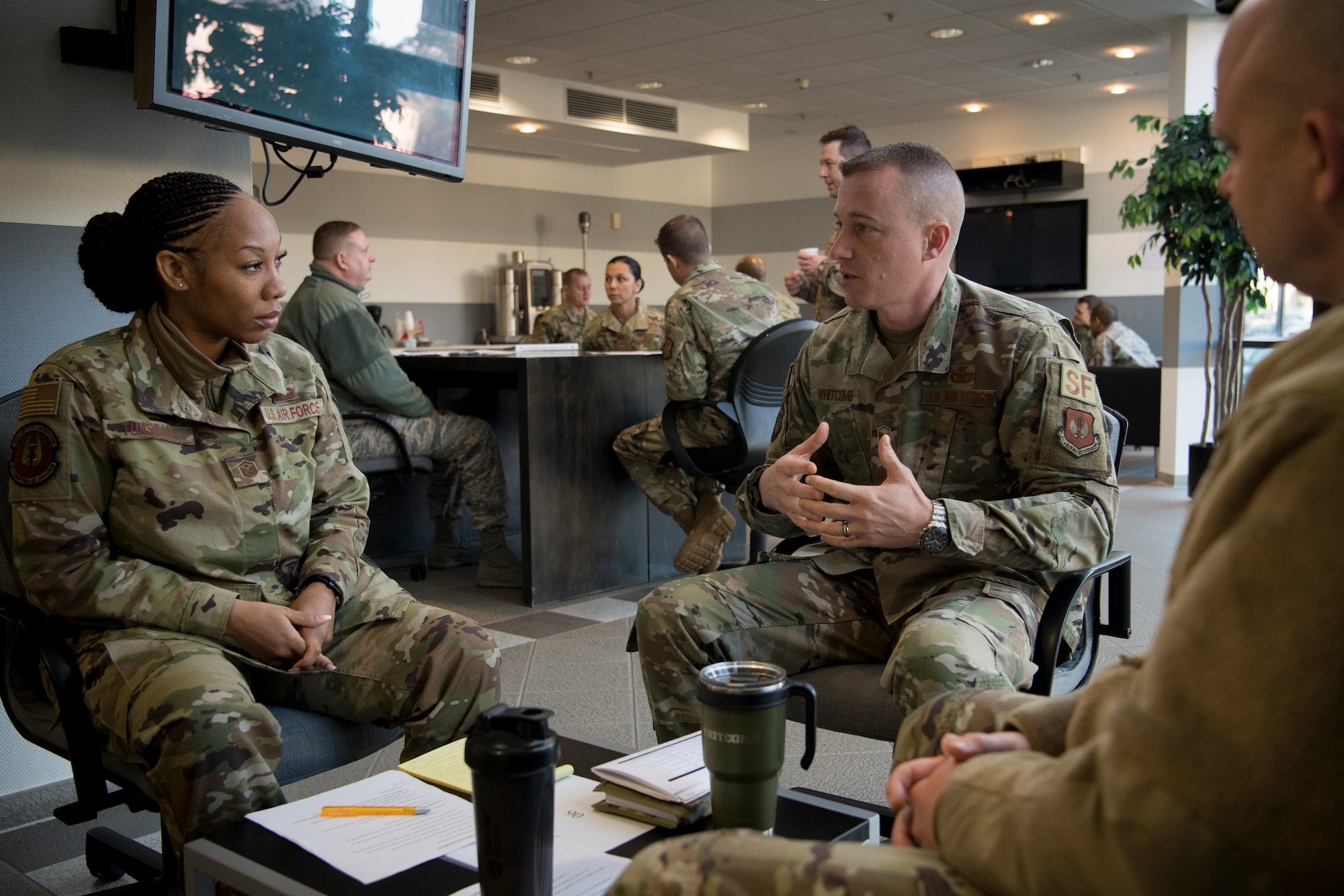 U.S. Air Force Master Sgt. Michael Whitcomb, 31st Security Forces Squadron section chief of plans and programs, center, practices opening statements with Master Sgt. Davina Tunstall, 86th Comptroller Squadron and Wing Staff Agencies first sergeant, during a Negotiation and Dispute Resolution training course at the U.S. Air Forces in Europe and Air Forces Africa Conference Center, Ramstein Air Base, Germany, Dec. 4, 2019.