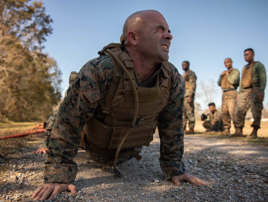 Staff Sgt. Matthew Driggers, fleet readiness center senior enlisted advisor with Marine Light Attack Helicopter Squadron 773, Marine Aircraft Group 49, executes a pushup during Martial Arts Instructor Course 1-20 aboard Naval Air Station Joint Reserve Base New Orleans, Dec. 4, 2019. The course consists of both physical and mental challenges to mold Martial Arts Instructors. (U.S. Marine Corps photo by Pfc. Colby Bundy)
