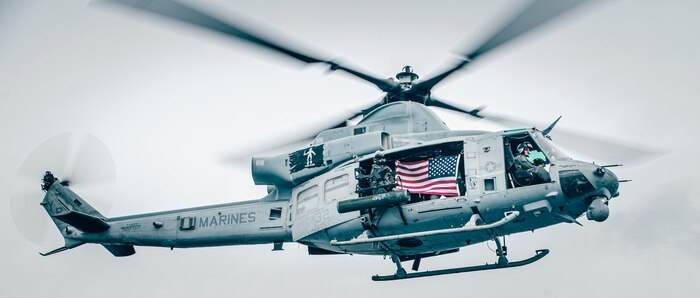 U.S. Marines with Marine Medium Tiltrotor Squadron 163, 11th Marine Expeditionary Unit, fly a UH-1Y Venom past the San Antonio-class amphibious transport dock ship USS John P. Murtha during an air power demonstration. The Marines and Sailors of the 11th MEU are conducting routine operations as part of the Boxer Amphibious Ready Group in the eastern Pacific Ocean.