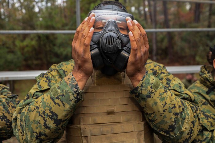 U.S. Marine Corps Lance Cpl. Brennon Gant, an administrative specialist with the 22nd Marine Expeditionary, Unit test his gas mask prior to an Individual Protective Equipment Confidence training at the gas chamber aboard Camp Lejeune, N.C., Nov. 15, 2019. The exercise helps familiarize Marines and Sailors with their CBRN equipment and enhance their proficiency in CBRN defense situations.