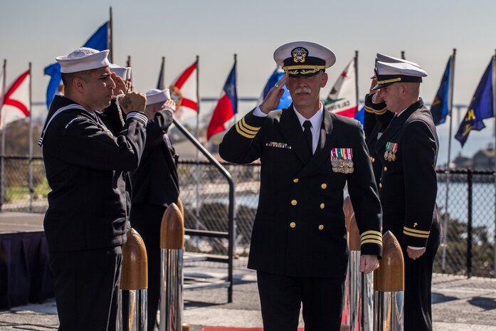 Cmdr. Doran Kelvington, Marine Corps Recruit Depot, San Diego, Recruit Training Regiment Chaplain conducts the end of his retirement ceremony, a Naval tradition known as rendering honors. Rendering honors is a tradition practiced to honor officers as they aboard or depart a Navy ship.