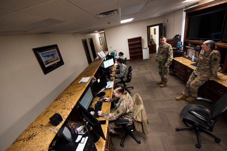 A photo of Airmen checking weather forecasts