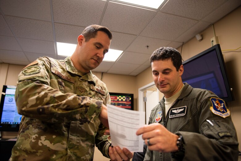 A photo of an Airman giving a weather brief