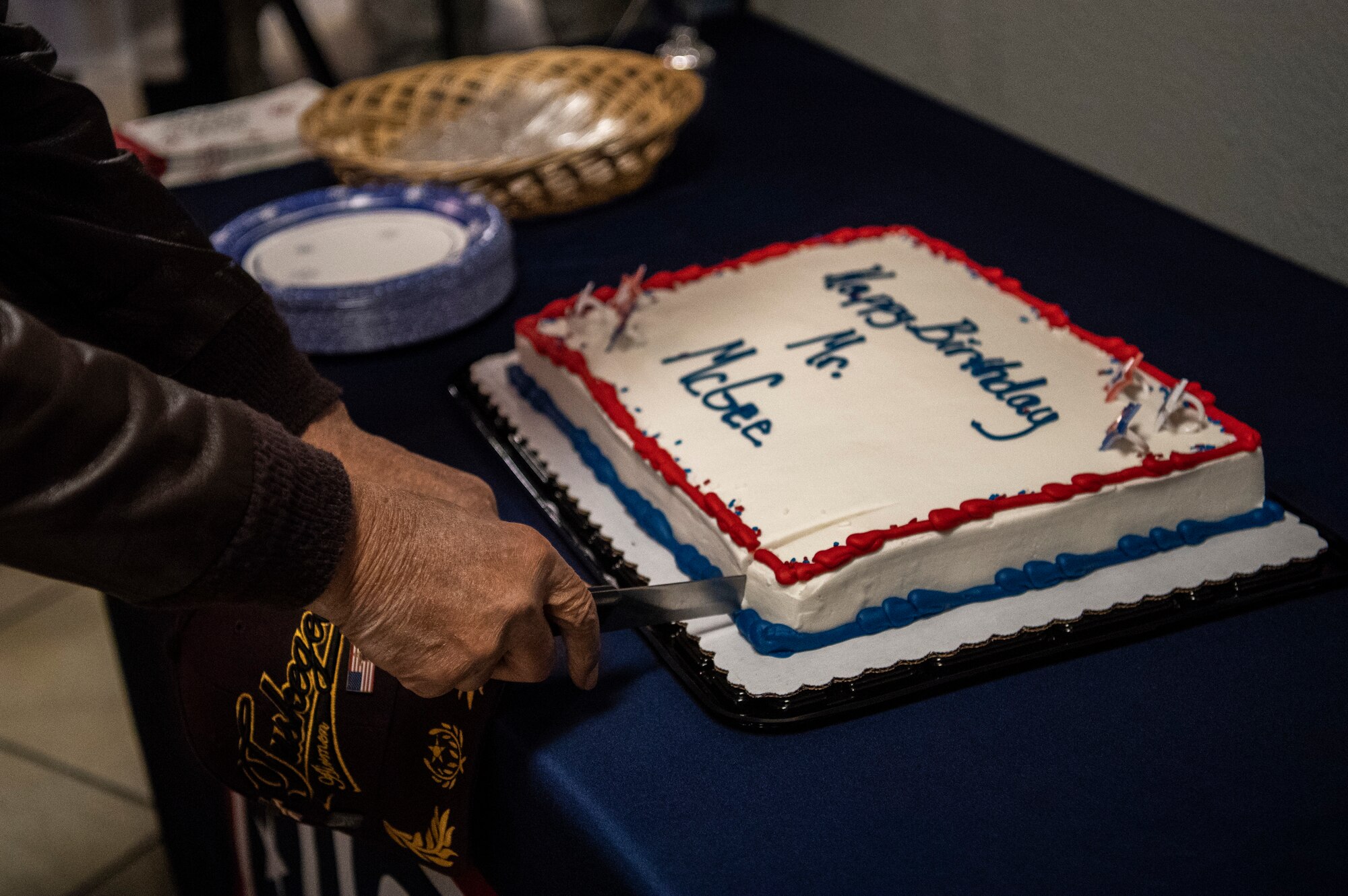 Former Tuskegee Airman, retired Col. Charles McGee, cuts the cake for his 100th birthday Dec. 6, 2019, at Dover Air Force Base, Del. McGee was born in Cleveland, Ohio, Dec. 7, 1919. He served a total of 30 years in the U.S. Air Force, beginning with the U.S. Army Air Corps, and flew a total of 409 combat missions in World War II, Korea and Vietnam. The Tuskegee program began in 1941 when the 99th Pursuit Squadron was established, and its Airmen were the first ever African-American military aviators in the U.S. Army Air Corps. (U.S. Air Force photo by Senior Airman Christopher Quail)
