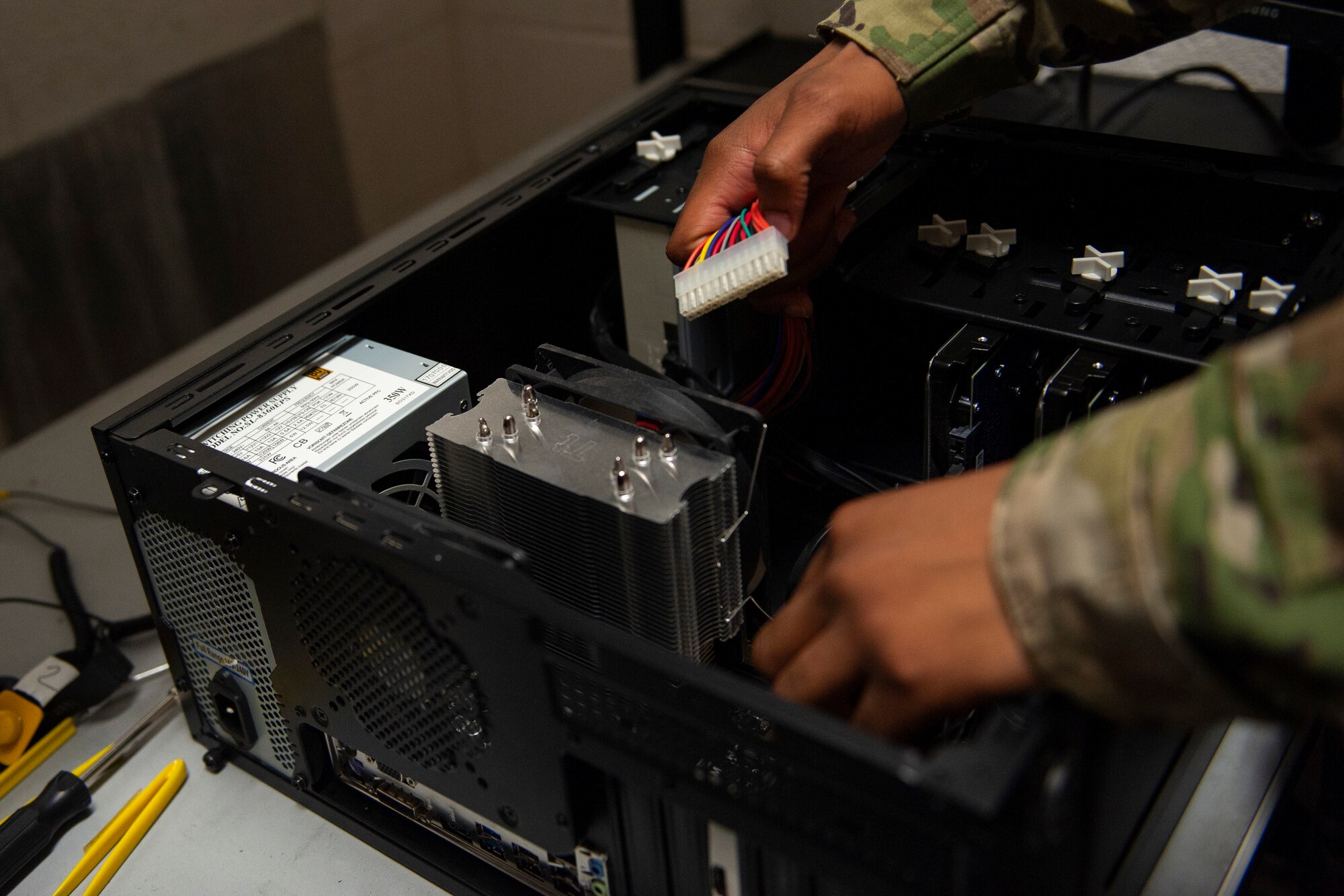 Photo of Airman unplugging a power connector